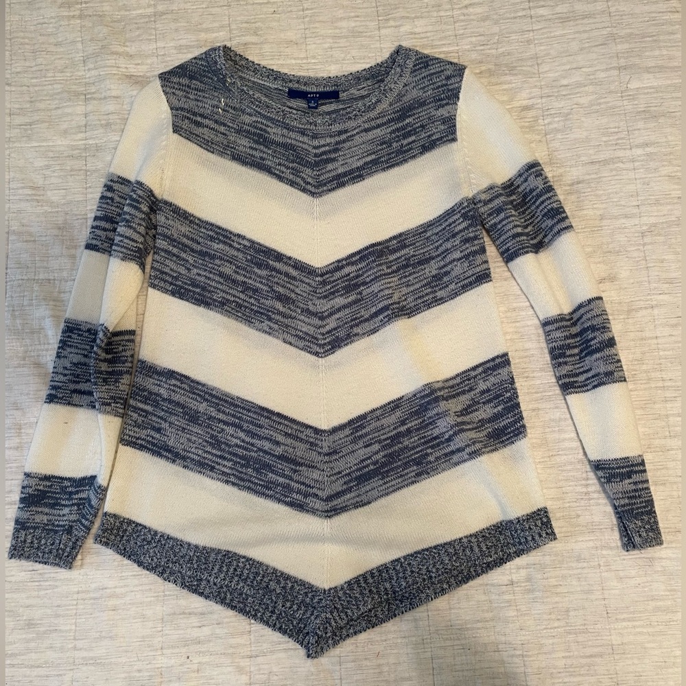 Blue and white striped sweater, slightly worn.